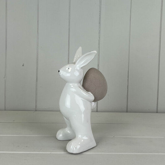 Ceramic White Rabbit holding an Egg H17.5cm W8.1cm D10.5cm  Weight-289g