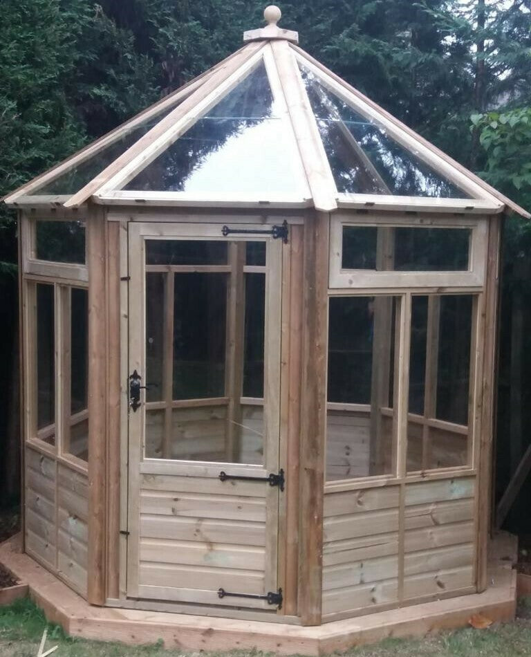 The Round Timber Greenhouse